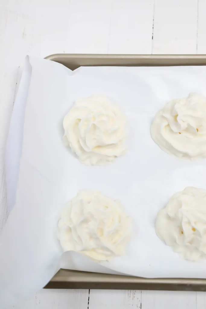 Frozen Whipped Cream Snowman  Cultivating Brilliant Minds whipped cream on parchment paper